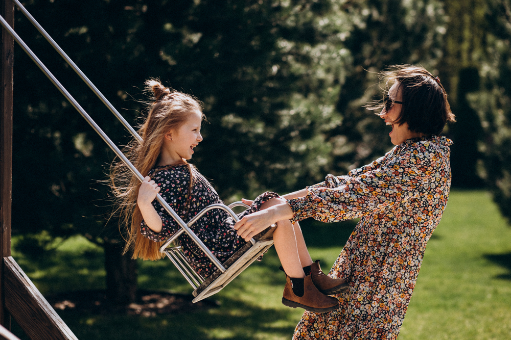 Parent swinging child